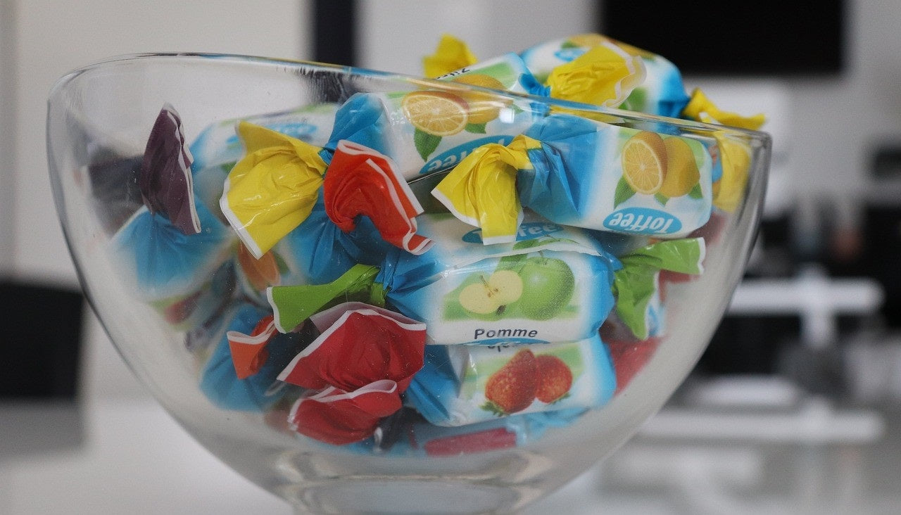 Wrapped candies in a glass candy bowl